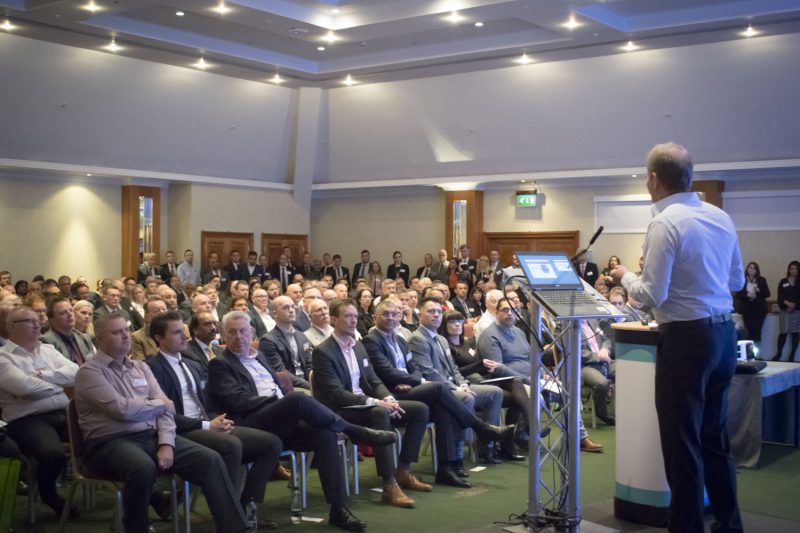 Image of a man presenting to a conference