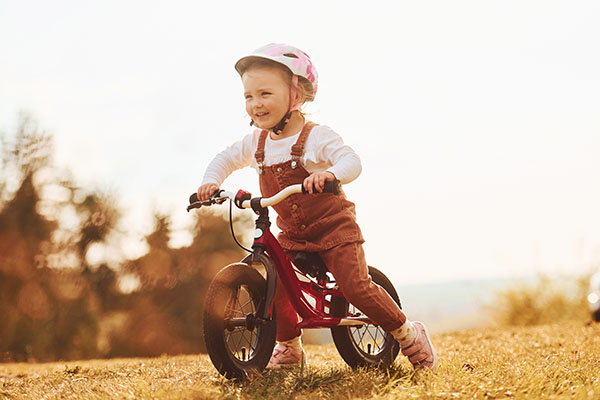Young girl riding her bike