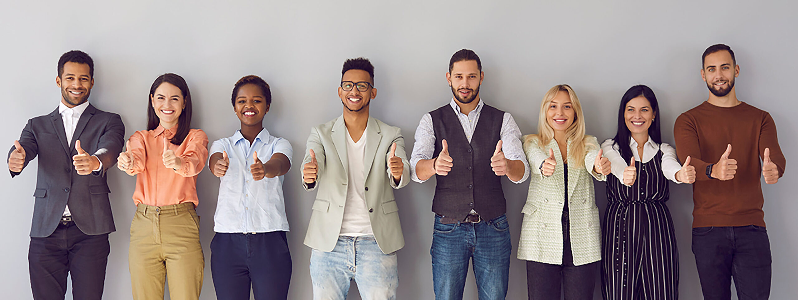 Contact us - colour image of diverse group of people with thumbs up