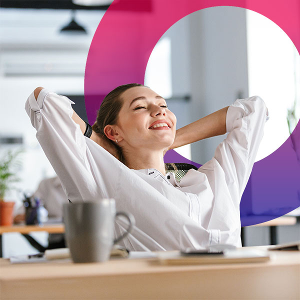 Homepage | Highlights image | Smiling female Mortgage broker reclining at desk with coffee cup foreground and Mortgage Brain circular gradient element behind