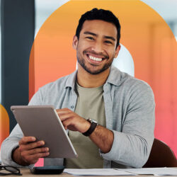 Homepage | Highlights image | Smiling male Mortgage broker reclining with tablet and Mortgage Brain favicon clip gradient element behind