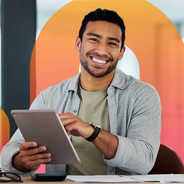 Homepage | Highlights image | Smiling male Mortgage broker reclining with tablet and Mortgage Brain favicon clip gradient element behind