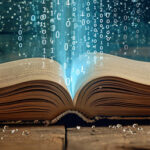 AI Zone | Featured image for AI Glossary showing a large old book flat on a table with code coming out of it