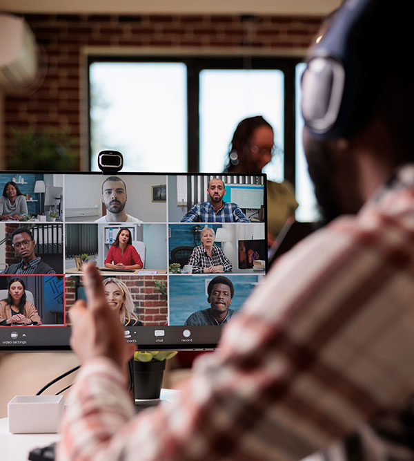 Training and events | Image of a trainer in front of a screen during a webinar with nine people taking part