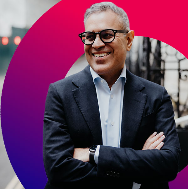 AI Zone | AI Charter featured image with Zahid Bilgrami pictured overlaying a blue red gradient background